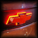 Close-up of Illuminated LED Rear Bowtie Emblem installed on a Chevrolet Camaro.