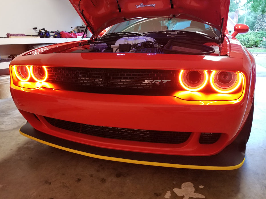 Red dodge challenger with red surface mount halos on.