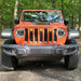 Front end of a Jeep Wrangler JL with amber Pre-Runner Style LED Grill Light Kit installed.