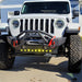 Front end of a white Jeep with LED Integrated Skid Plate installed.