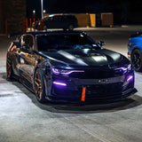 Three quarters view of a black Chevrolet Camaro with purple headlight and fog light DRLs.