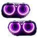 Dodge Challenger headlights with pink LED halo rings.