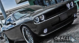 Three quarters view of a Dodge Challenger with white LED headlight and fog light halos installed.