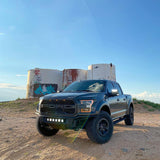 Three quarters view of a Ford Raptor with 2015-2020 Ford F-150 LED Off-Road Side Mirrors installed.