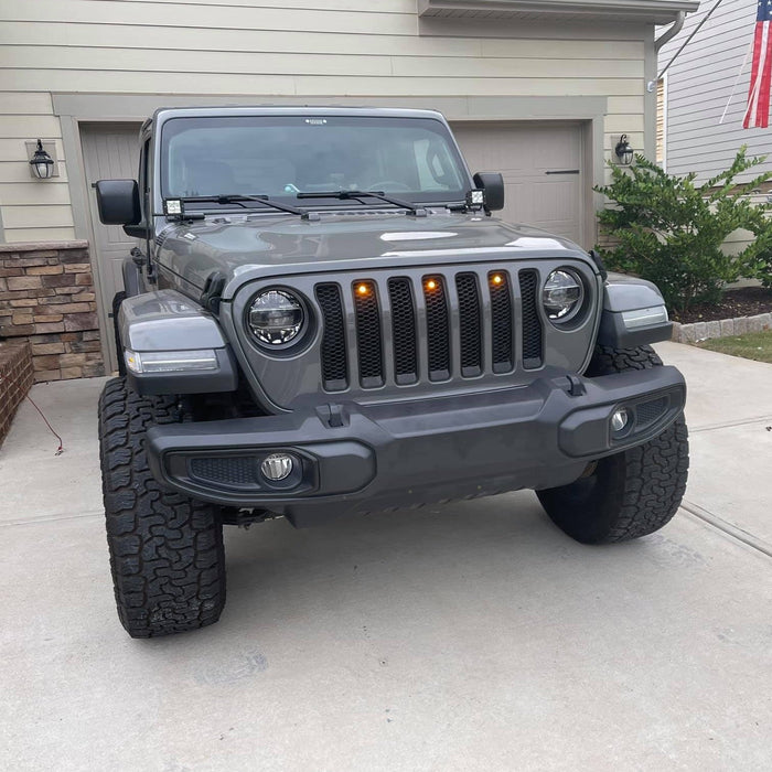 Front end of a Jeep Gladiator JT with amber Pre-Runner Style LED Grill Light Kit installed.