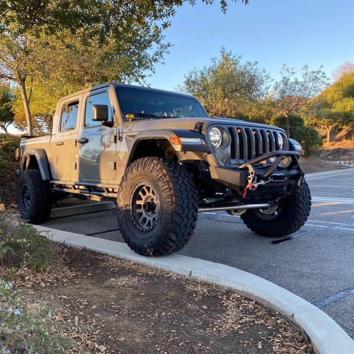 Three quarters view of a Jeep Gladiator JT with amber Pre-Runner Style LED Grill Light Kit installed.