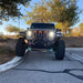 Front end of a Jeep Wrangler JL with amber Pre-Runner Style LED Grill Light Kit installed.