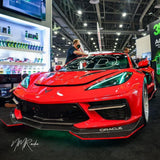 Red C8 Corvette in a showroom with aqua green headlight DRLs.