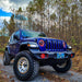 Three quarters view of a blue Jeep Wrangler JL with white Pre-Runner Style LED Grill Light Kit installed.