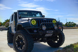 Three quarters view of a Jeep Wrangler JK with yellow LED headlight halos installed.