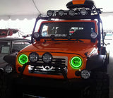 Front end of a Jeep Wrangler JK with green LED headlight halos installed.