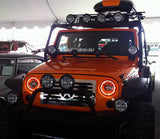 Front end of a Jeep Wrangler JK with amber LED headlight halos installed.