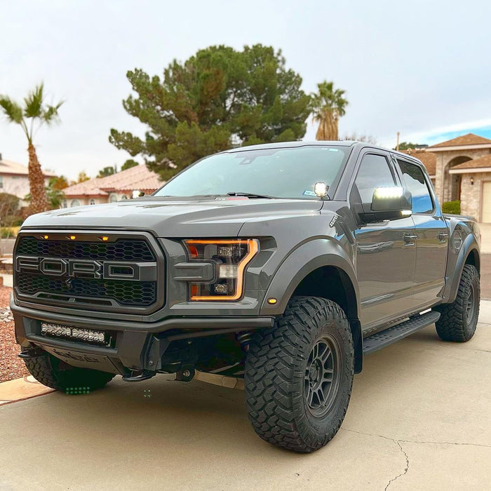 Three quarters view of a Ford Raptor with 2015-2020 Ford F-150 LED Off-Road Side Mirrors installed.