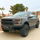 Three quarters view of a Ford Raptor with 2015-2020 Ford F-150 LED Off-Road Side Mirrors installed.