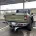 Rear view of a Jeep Gladiator with Rear Bumper LED Reverse Lights installed.