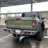 Rear view of a Jeep Gladiator with Rear Bumper LED Reverse Lights installed.