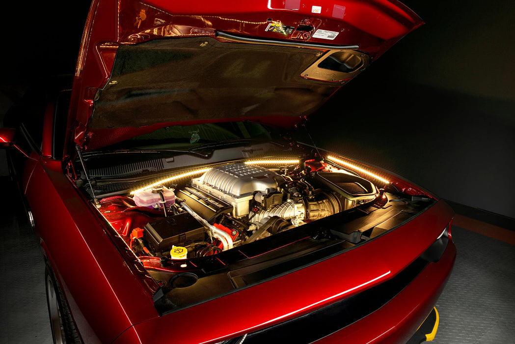 Red Challenger with yellow engine bay lighting.