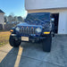 Jeep Wrangler JL with amber Pre-Runner Style LED Grill Light Kit installed.