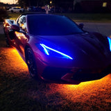 Three quarters view of a C8 Corvette with blue headlight DRLs.