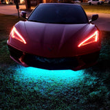 Front end of a C8 Corvette with amber headlight DRLs.