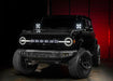 Three quarters view of a black Ford Bronco with 2 7" Multifunction LED Spotlights installed on the dash.