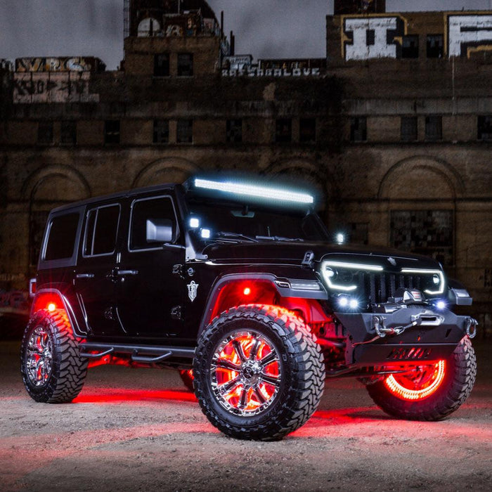 Three quarters view of a black Jeep with multiple ORACLE Lighting products installed.