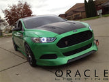 Three quarters view of a Ford Fusion with white LED headlight halo rings installed.