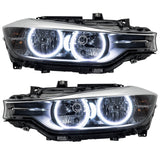 BMW 320 headlights with white LED halo rings.