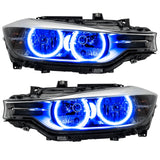 BMW 320 headlights with blue LED halo rings.