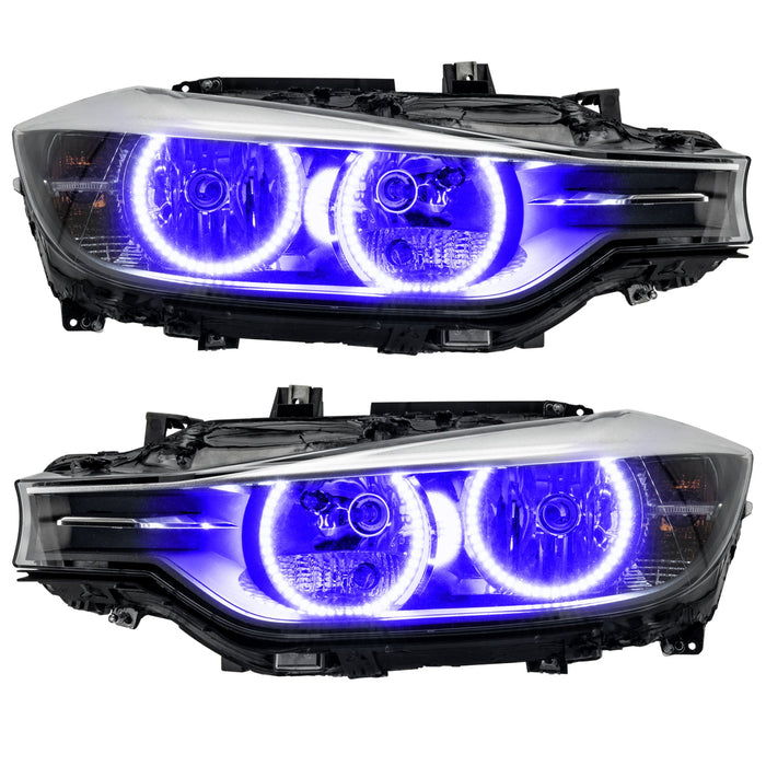 BMW 320 headlights with purple LED halo rings.