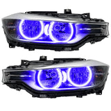 BMW 320 headlights with purple LED halo rings.