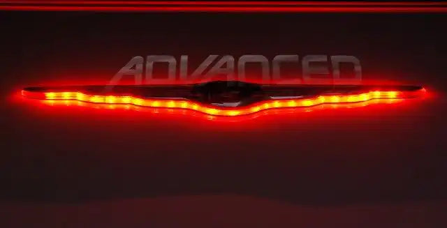 Gen I Chrysler Illuminated LED Rear Wing Emblem with red LEDs.
