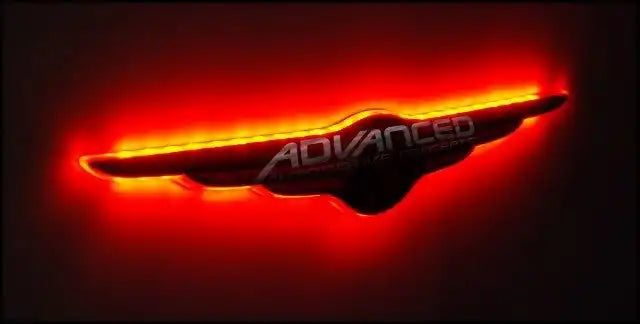 Gen I Chrysler Illuminated LED Rear Wing Emblem with red LEDs.
