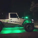 Side view of a Jeep with green LED rock lights.