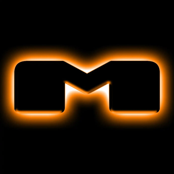 The letter "M" Amber LED Illuminated Letter Badge with matte black finish.