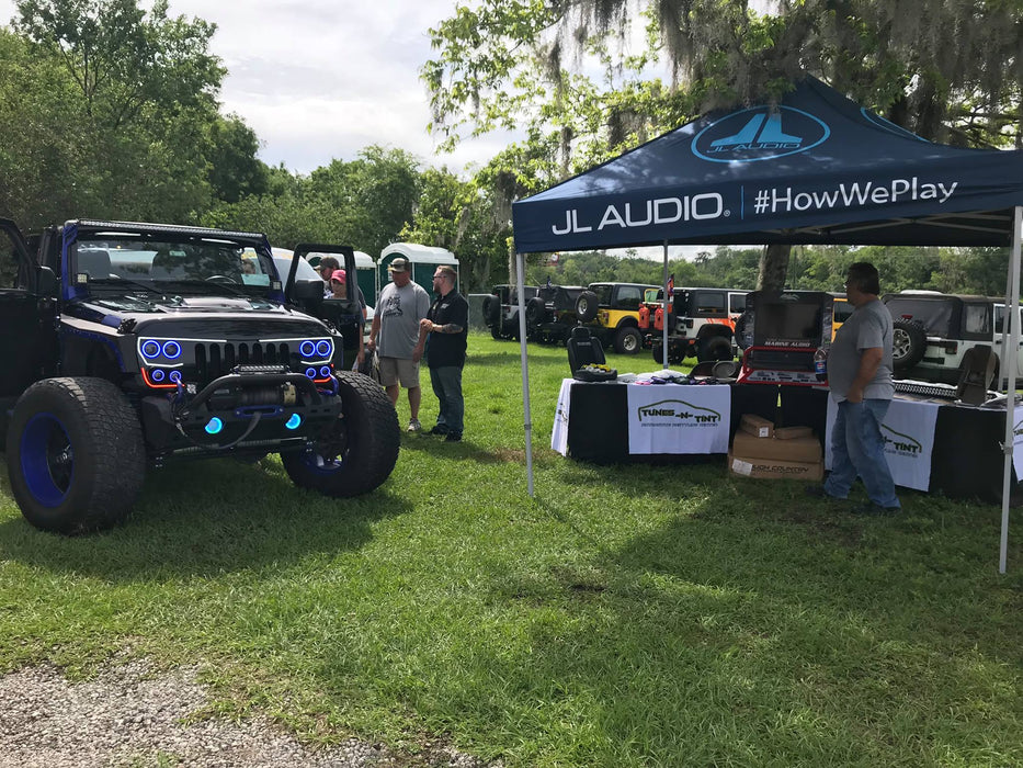 Jeep Wrangler at a car meet with Vector Series Grill LED Halo Kit installed.