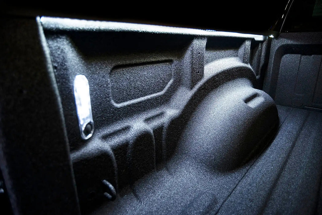 Close-up of a truck bed with Truck Bed LED Cargo Light 60” Pair w/ Switch installed.