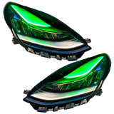 Tesla Model 3 headlights with green DRLs.