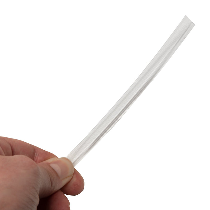 A hand holding a fiber optic cable