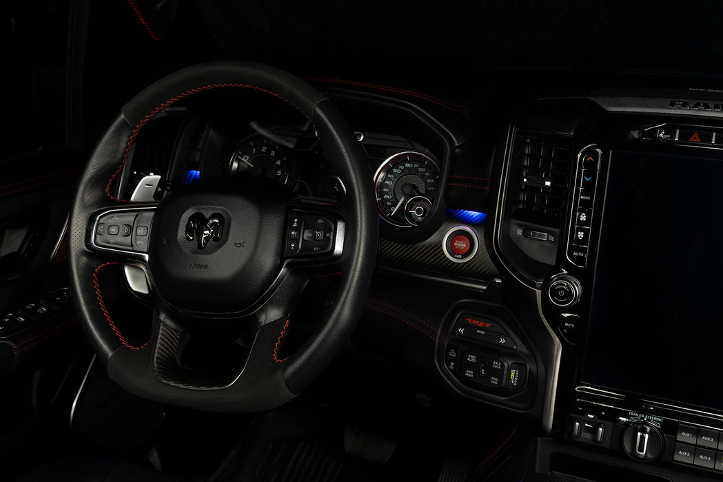 Drivers side seat of a RAM TRX with blue LED ambient lighting.