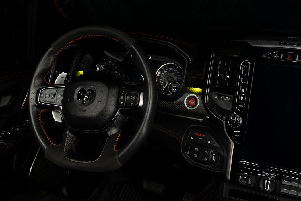 Drivers side seat of a RAM TRX with yellow LED ambient lighting.