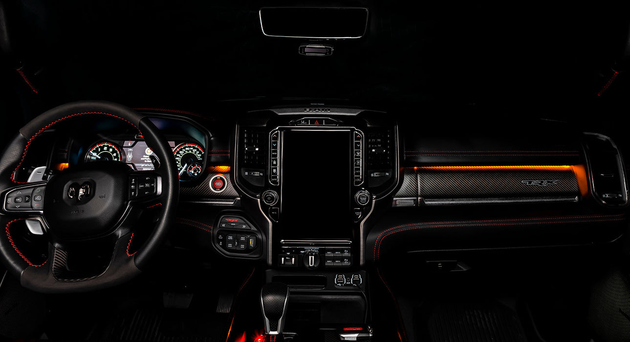 View of a RAM TRX dashboard from the backseat with amber LED ambient lighting kit.