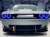 Front end of a silver Dodge Challenger with blue LED headlight halo rings installed.