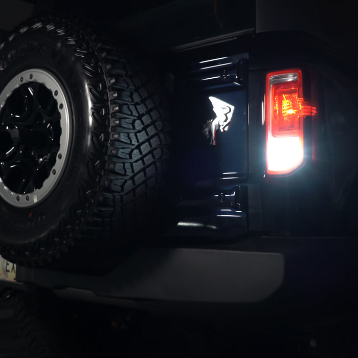 Close-up on rear bronco tail light with bright reverse lights on
