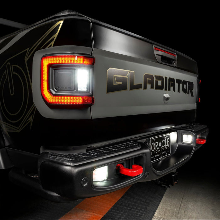 Close-up on the rear end of a Jeep Gladiator with reverse lights on.