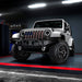 Three quarters view of a white Jeep Wrangler JK with 7" Oculus Headlights installed.