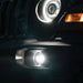 Front end of a Jeep with High Performance 20W LED Fog Lights installed and turned on.