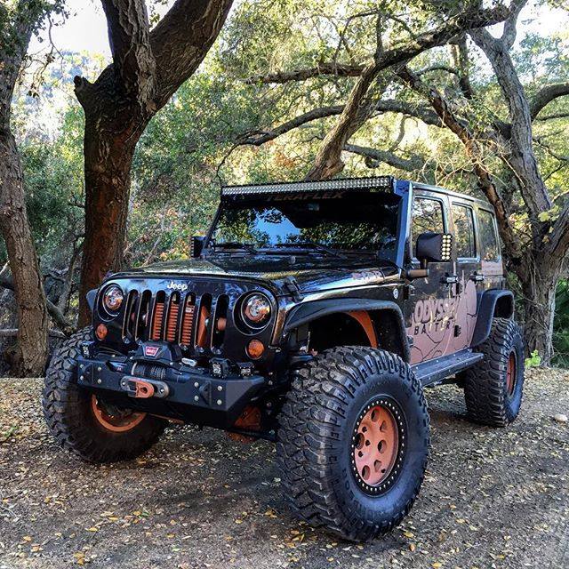 Three quarters view of a Jeep Wrangler JK with LED Off-Road Side Mirrors installed.