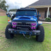 Front end of Jeep Wrangler with purple Vector™ Series Grill LED Halo Kit