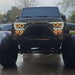 Front end of a Jeep Wrangler with Vector™ Series Grill LED Halo Kit installed.